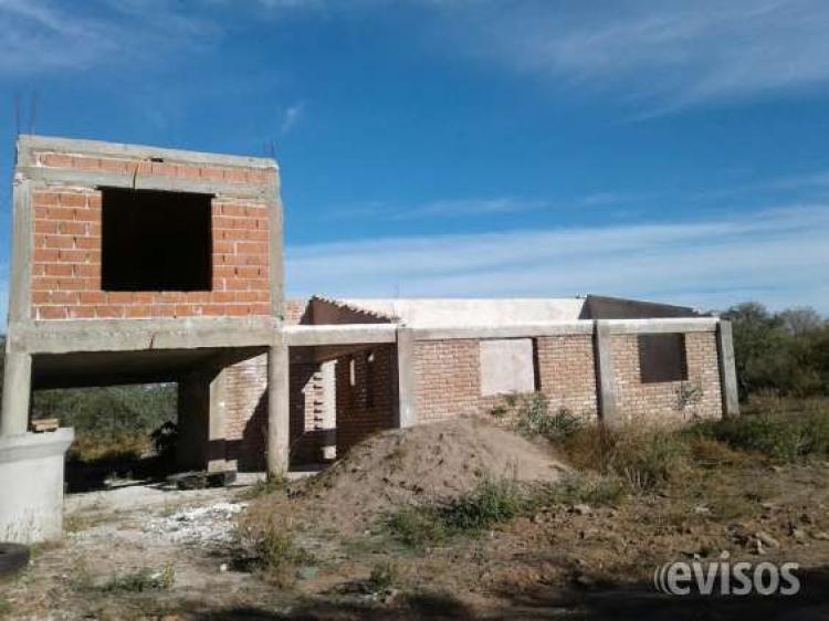 VENDO TERRENO CON CASA EN CONSTRUCCION